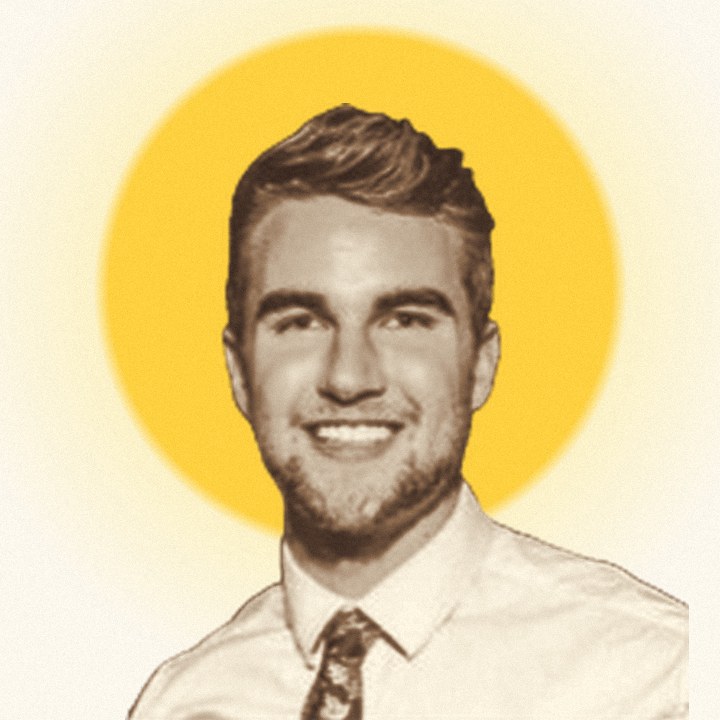 Portrait of Richard Eve in front of a yellow sun