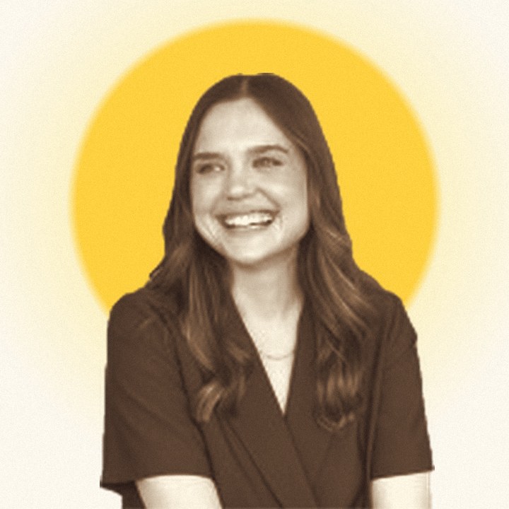 Portrait of Samantha Callender in front of a yellow sun